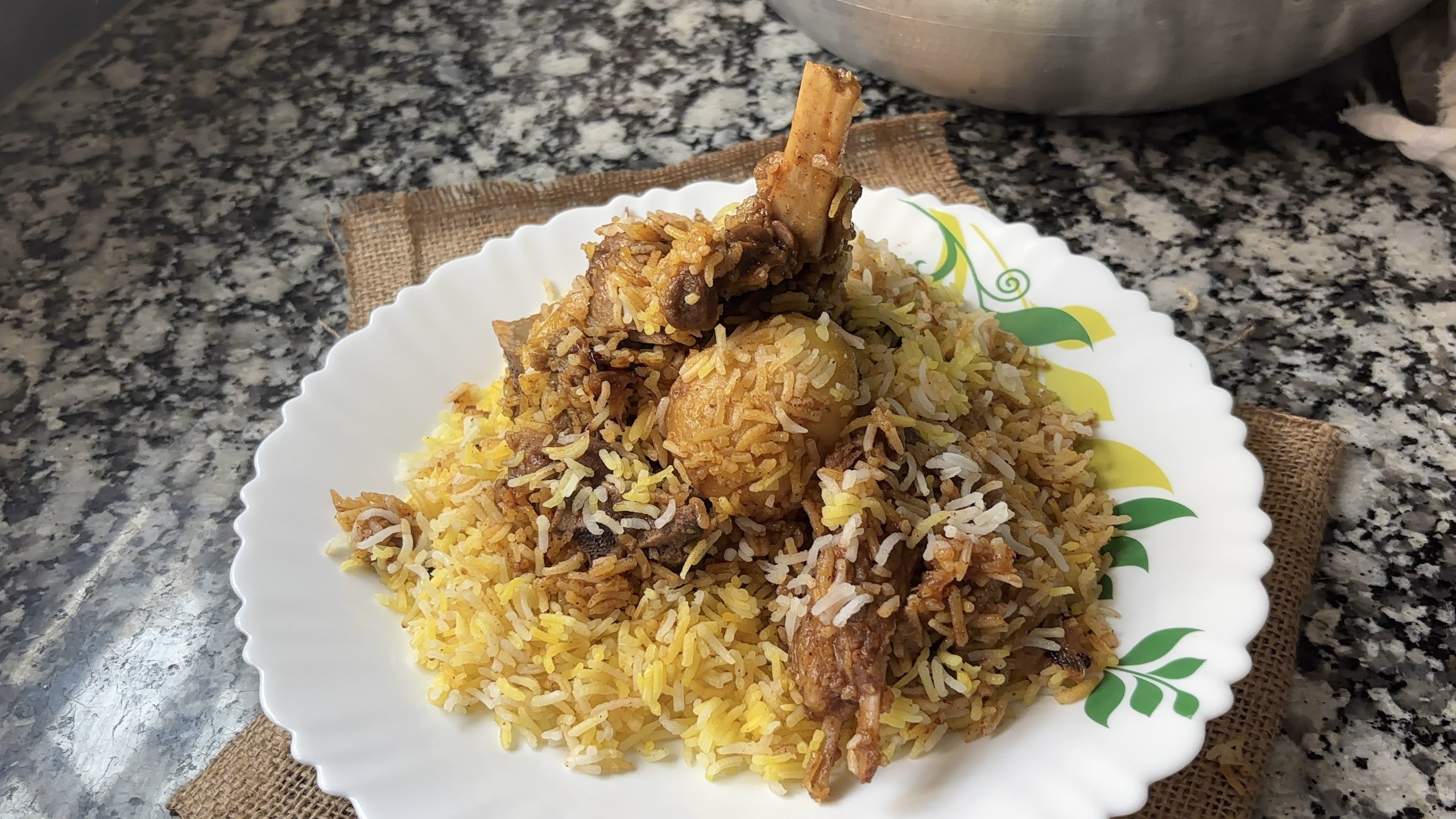 Authentic Kolkata style mutton biryani with potato and long basmati rice grains